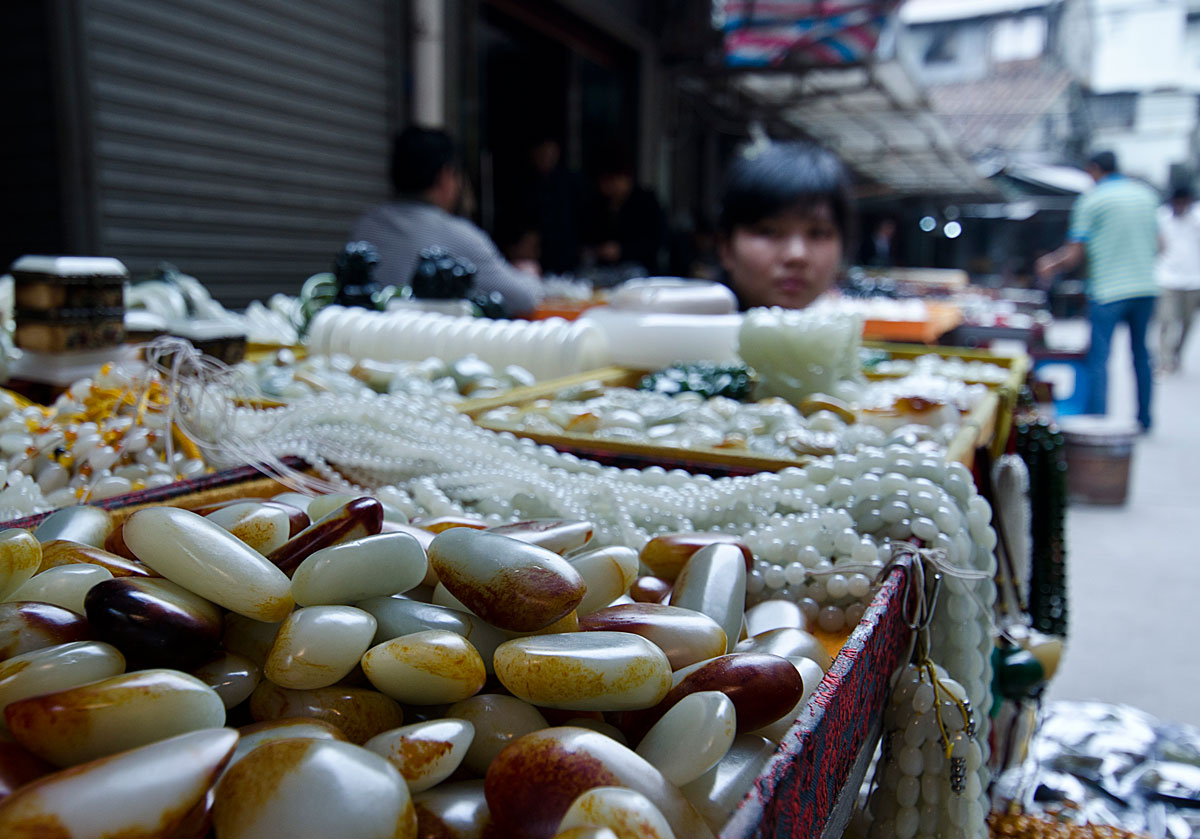 Figure 13. What appears to be Chinese nephrite in Guangzhou's Hualin Street jade market. The stains on the surfaces of these stones are possibly artificial. Photo: Richard W. Hughes.