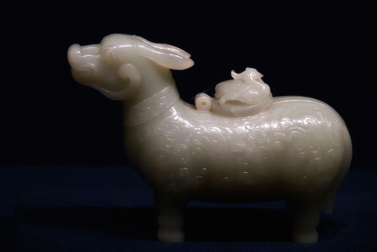 Figure 15. Ox-shaped xun (wine vessel) carved from Chinese nephrite on display in Shanghai's Shanghai Museum. Quianlong Reign (AD 1736–1795). Qing Dynasty. Over the past two decades the Chinese have rediscovered their love of nephrite jade, with the white stone from Hotan now fetching near-jadeite prices. Photo: Richard W. Hughes.