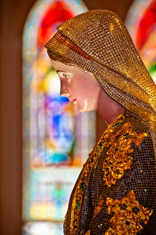 In 2009, the Mary Immaculate Conception Cathedral in Chanthaburi was refurbished. It now includes this 1.3 m icon of Mary, inlaid with over 20,000 carats of sapphire and other gems. Photo © Richard W. Hughes.