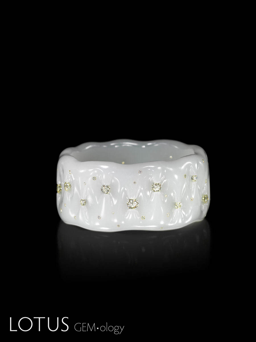 Tender is my Skin by Wallace Chan. Russian nephrite with diamonds. This piece uses an innovated carving technique to suspend diamonds in the bangle without having to us metal prongs. 7.8 x 6.8 x 3.4 cm.; 2015. Photo: Wallace Chan. Click on the photo for a larger image