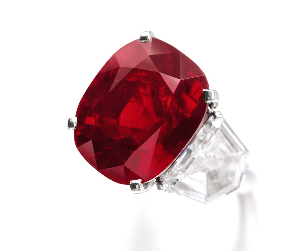 The Sunrise Ruby, a 25.59 ct Burmese ruby ring by Cartier sold for US$32.42 million ($1,266,901/ct) at Sotheby's Geneva on 12 May, 2015, a per carat and total price world ruby auction record. It currently holds the title as the most expensive colored gemstone in the world. Image © Sotheby's