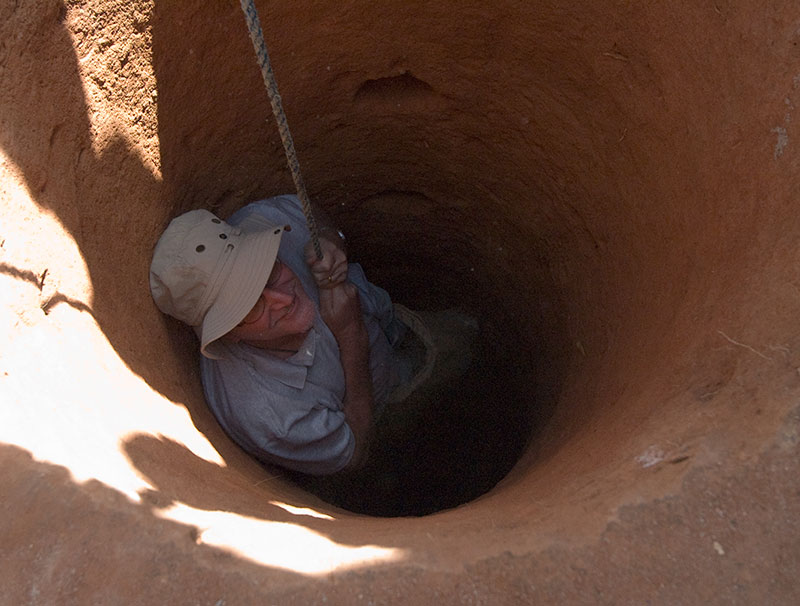 Richard Hughes descending into a gem pit in Madagascar. An album of photos such as this can help jewelers close sales because of the aura of expertise they establish. Photo: Vincent Pardieu.