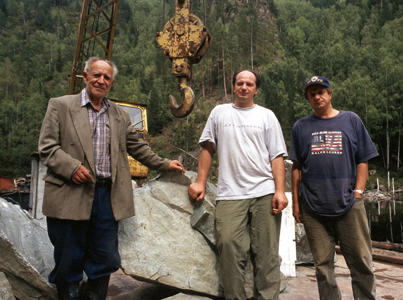 Mikhail "Misha" Khrolenko (center) and his father Yakov Borisovich(left) and brother Sergei (right), owners of the Khakassia jade mines. They are standing in front of a huge chunk of Khakassia jadeite. Photo: © Richard W. Hughes