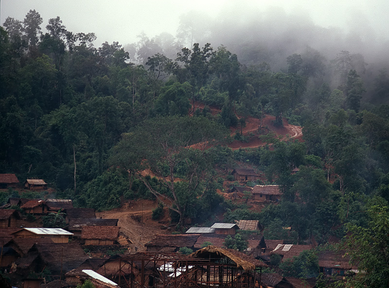 The small village of Hweka, with the rain-soaked track to Hpakan leading into the mist