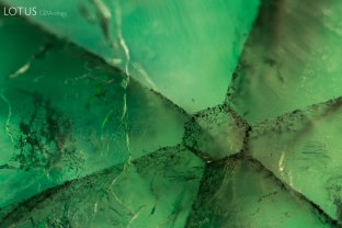 Close up of a trapiche emerald. The hexagonal structure of the emerald can be clearly observed.