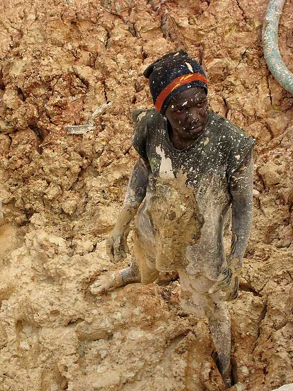 A mud-spattered sapphire miner at Ngembambili Amanimakoro, Songea. Photo: Richard W. Hughes
