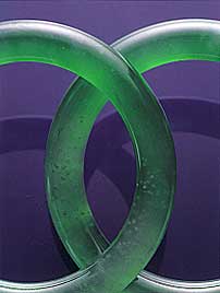 Figure A-1. Although nephrite jade is China's original "Stone of Heaven," fine jadeite, as in this matched pair of semi-transparent bangles (53.4 mm in interior diameter, 9.8 mm thick), is the most sought-after of jades in the Chinese community today. Photo courtesy of and © Christie's Hong Kong and Tino Hammid.