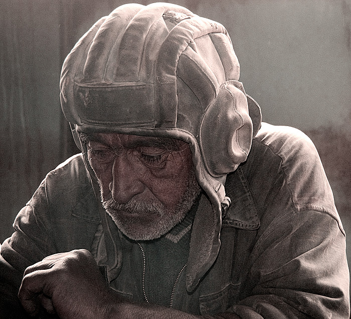 A miner rests during lunch at Tajikistan's ruby mines near the Chinese border. Photo: Richard W. Hughes