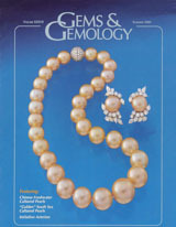 Gem News International: A brownish green sapphire, with pyrochlore inclusions