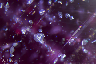 Mozambique rubies contain mixed silk, where part is rutile and part is another mineral. When heated, the non-rutile portion may show breakdown in the form of mottling or bubbles, as seen here.