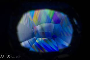 Polysynthetic twinning is seen in dramatic relief within this Kashmir (India) sapphire when viewed between crossed polars.