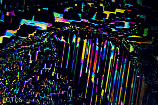 Fingerprints betray the underlying atomic symmetry. In this case, this iridescent fingerprint lies along a prism face, as demonstrated by its rectilinear form.