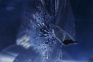 A negative crystal, cut through on the surface, is surrounded by a fingerprint “halo.”