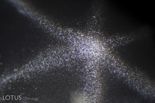 Fine silk creates a six-rayed star in this spinel. Spinel has the ability to display six- or four-rayed stars, depending on how the stone is oriented during cutting. Six-rayed stars are seen if the cabochon base is parallel to the octahedron face, while four-rayed stars occur when the base is parallel to a cube face; 